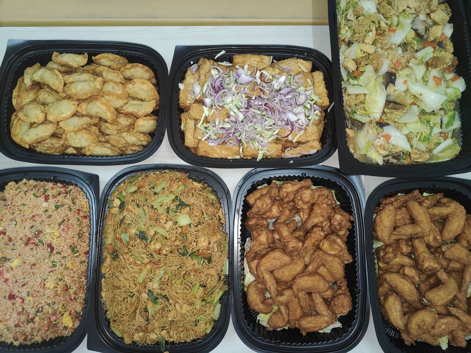Assorted catering boxes ready for a group order