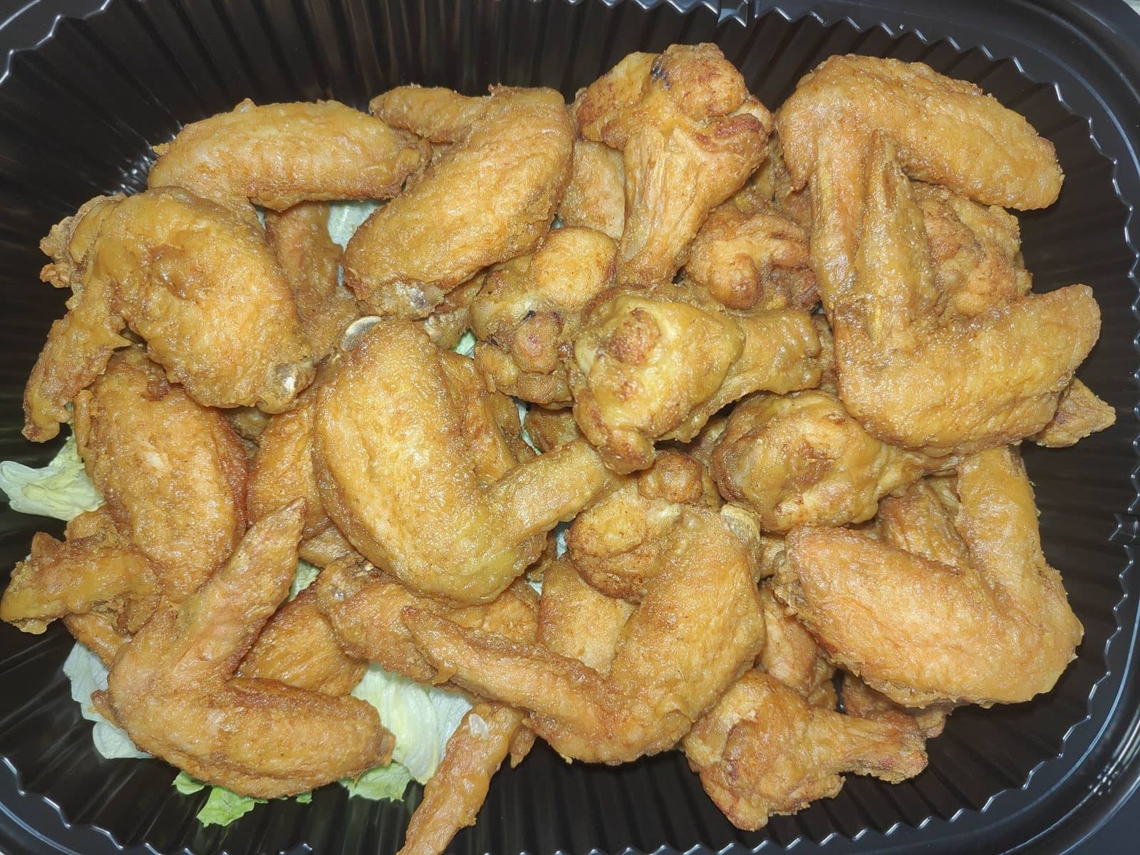Golden fried chicken wings tray